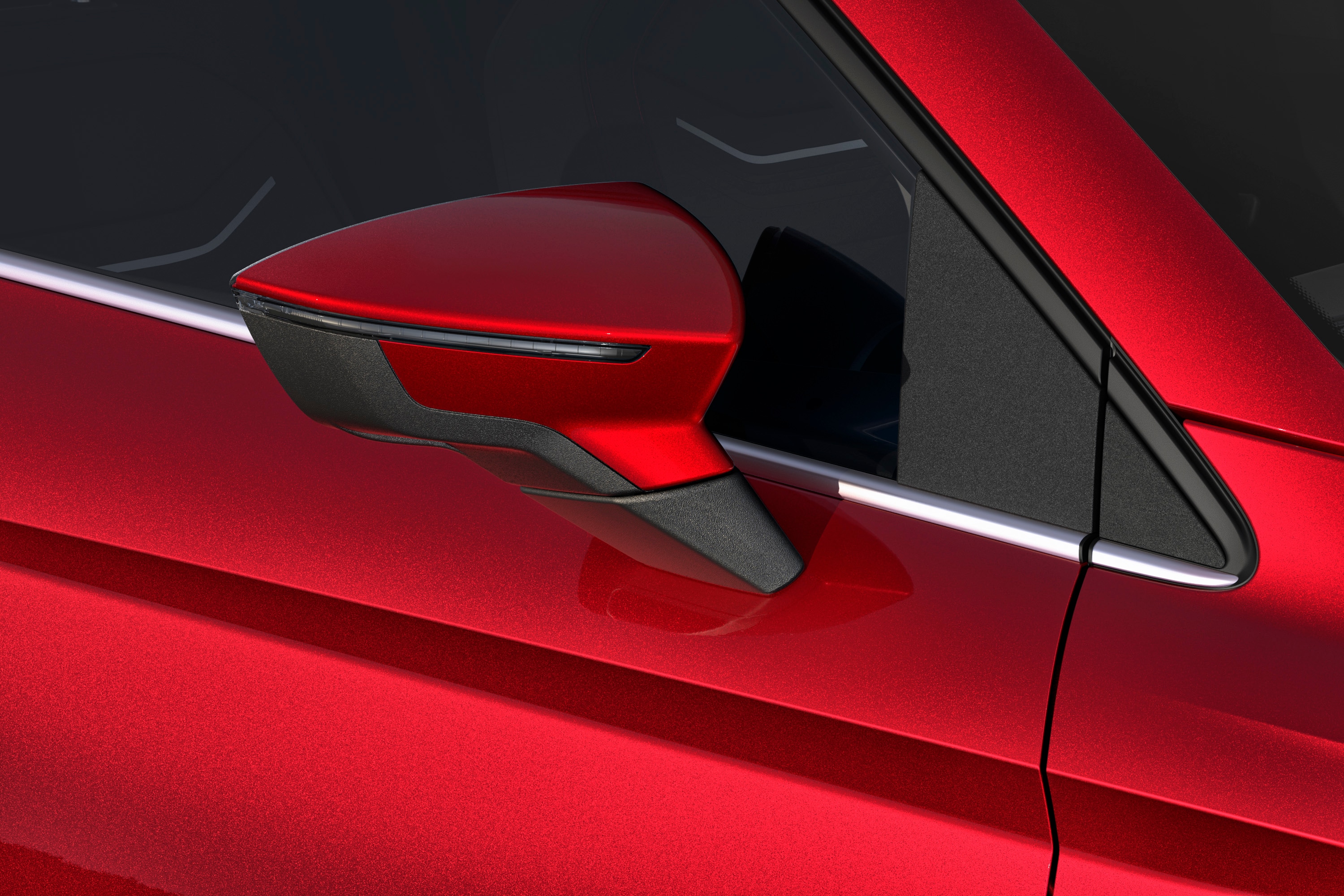 Seat Leon in desire red met een speciale metallic afwerking, van dichtbij.