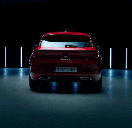 SEAT Leon hatchback 2025 plug in hybrid electric vehicle. Parked and charging outdoors, featuring spoke alloy wheels, interior ambient lighting and heated front seats for optimal comfort.