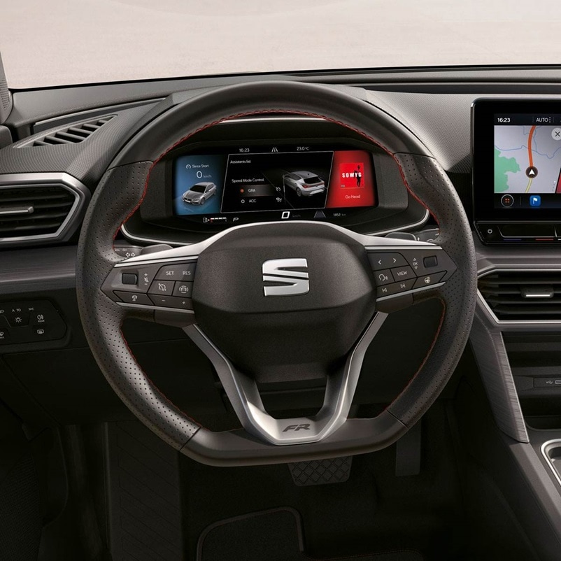 Interior view of the seat leon 2025's digital dashboard, compatible with wireless apple carplay and carplay android auto, allong with lane assist and advanced driving aids.