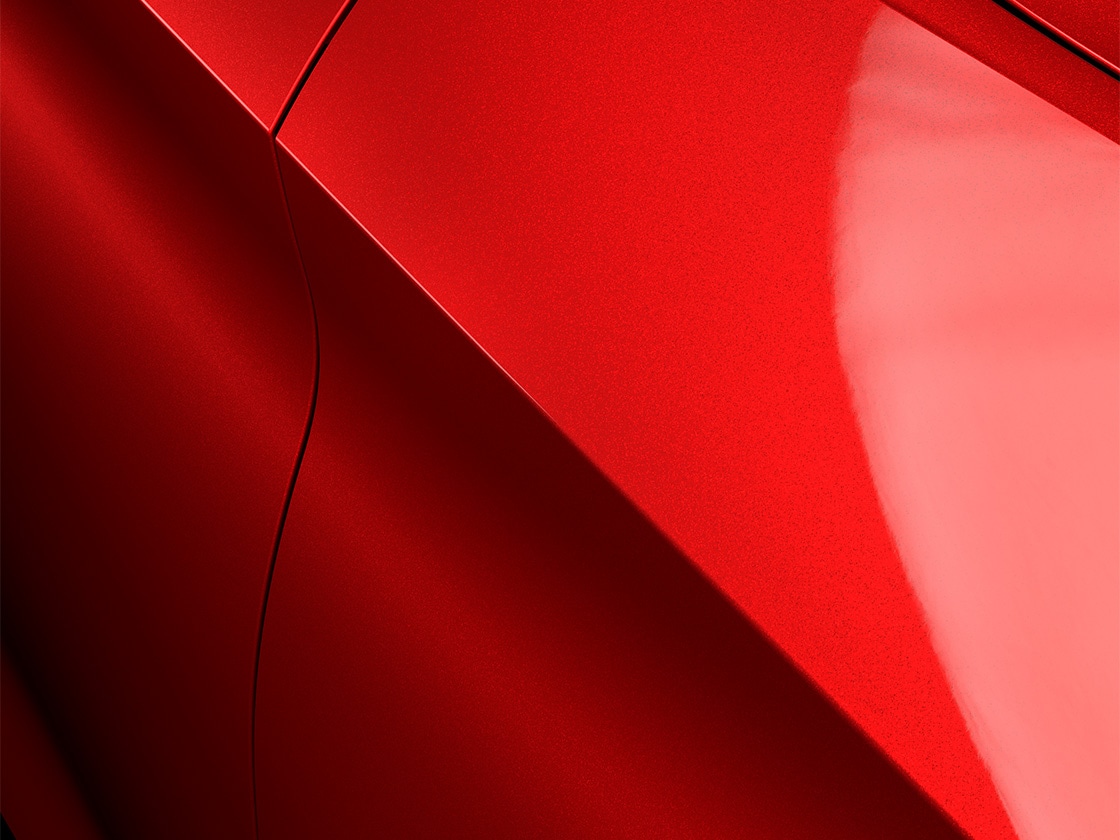 Seat Leon in desire red met een speciale metallic afwerking, van dichtbij.