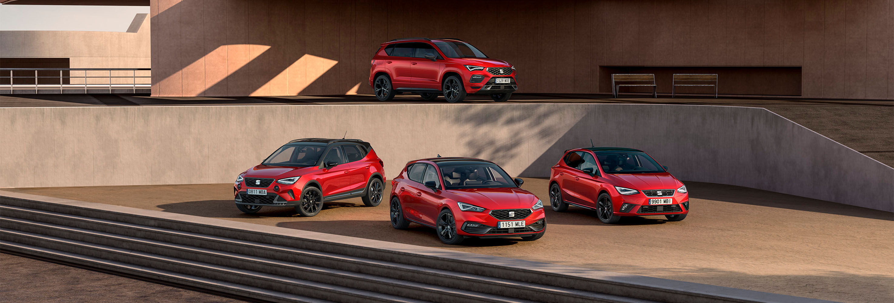 Een rode seat ibiza, rode seat arona, seat leon en seat ateca